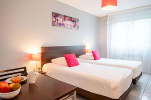 Postel nebo postele na pokoji v ubytování Comfort Aparthotel Besancon La City