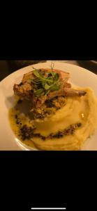 a white plate with two pieces of food on it at The Hind Hotel in Wellingborough