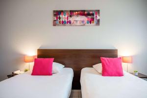Postel nebo postele na pokoji v ubytování Comfort Aparthotel Besancon La City