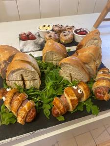 a tray of pastries and croissants on a table at The Hind Hotel in Wellingborough