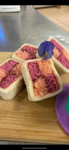 three pieces of bread with a flower on top at The Hind Hotel in Wellingborough