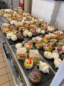 a buffet line with many different types of desserts at The Hind Hotel in Wellingborough