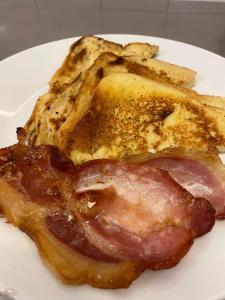 a plate of food with a piece of meat and bread at The Hind Hotel in Wellingborough