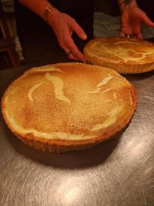 two pies sitting on top of a table at The Hind Hotel in Wellingborough