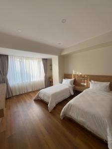 Tempat tidur dalam kamar di Hotel snowlion