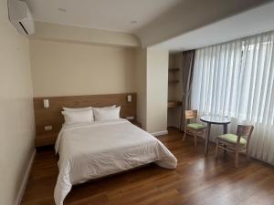 Tempat tidur dalam kamar di Hotel snowlion
