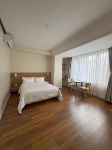 Tempat tidur dalam kamar di Hotel snowlion