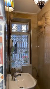 a bathroom with a sink and a window at Riad Morocco Sky in Marrakech +95 photos