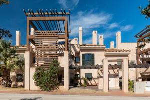 a building with a giant chair on top of it at El Oasis La Casita 1 Bajo A in Fuente Alamo