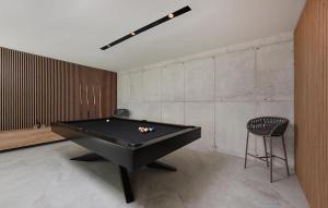 a black pool table in a room with a chair at Awesome Home In Zdrelac in Ždrelac