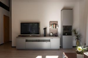 a living room with a television on top of a cabinet at Apartment Anna - FeWo 56qm2 - Hausen-Wied in Hausen-Wied