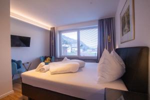 Łóżko lub łóżka w pokoju w obiekcie Panorama Apartments - Steinbock Lodges