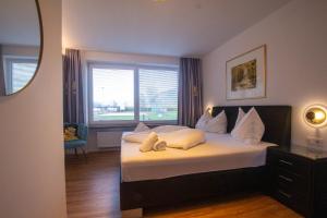 Łóżko lub łóżka w pokoju w obiekcie Panorama Apartments - Steinbock Lodges
