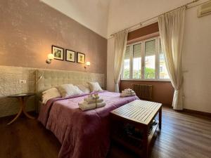 Postel nebo postele na pokoji v ubytování Aedes B&B Il Giardino dei Sogni