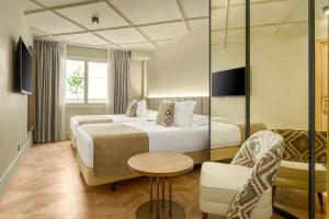 Ein Bett oder Betten in einem Zimmer der Unterkunft Room Mate Leo, Granada