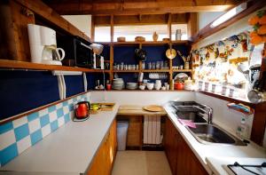 a small kitchen with a sink and a counter at chalet haute-savoie in Thollon