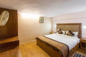 Postel nebo postele na pokoji v ubytování Hotel O Hotel Landmark Inn