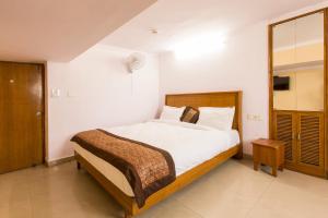 Postel nebo postele na pokoji v ubytování Hotel O Hotel Landmark Inn