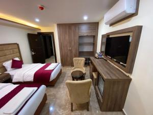 TV a/nebo společenská místnost v ubytování Sunset Hotel
