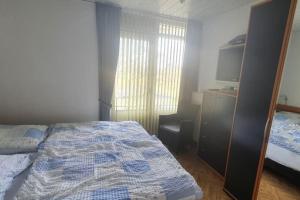 Ένα ή περισσότερα κρεβάτια σε δωμάτιο στο Perfect Appartement - Dichtbij Zee en Natuur