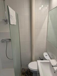 a bathroom with a toilet and a sink and a shower at Studio au coeur de Valence 22 in Valence