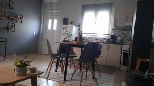a kitchen with a table and chairs in a room at Apt22 stylish apartment close of Heraklion center in Heraklio Town +11 photos
