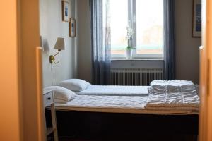 Voodi või voodid majutusasutuse Falköpings Vandrarhem/Hostel toas