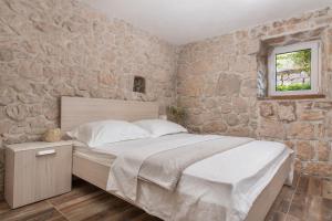 Posteľ alebo postele v izbe v ubytovaní Traditional Comfort Casa Natura with 36m2 Pool + 37 fotografií