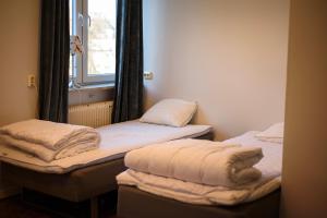 Voodi või voodid majutusasutuse Falköpings Vandrarhem/Hostel toas