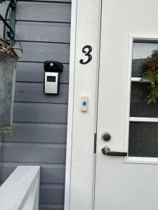 a house with a door with the number three on it at Aurora Center 3 in Rovaniemi