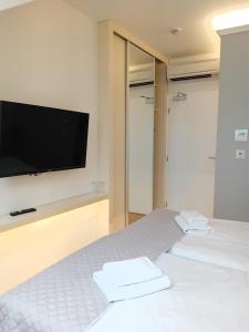 Postel nebo postele na pokoji v ubytování hotel Chmelnice