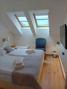 Postel nebo postele na pokoji v ubytování hotel Chmelnice