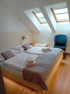 Postel nebo postele na pokoji v ubytování hotel Chmelnice