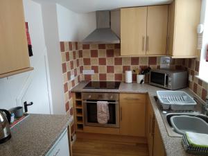 Kuchyň nebo kuchyňský kout v ubytování Old Dairy Cottage