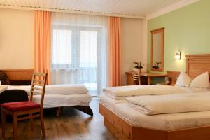 Postel nebo postele na pokoji v ubytování Pension Norika