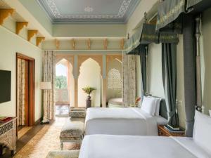 Raffles Jaipur客房内的一张或多张床位