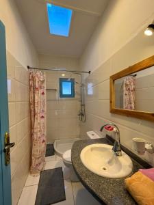 a bathroom with a sink and a toilet and a mirror at Dream house in Luxor +27 photos