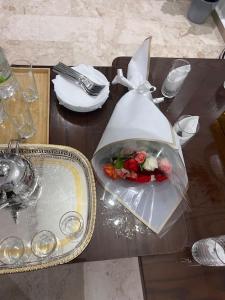 a table with a plate of food in a plastic bag at Appartement de luxe à Casablanca in Aïn Sebaa