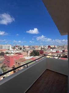 a balcony with a view of a city at Appartement de luxe à Casablanca in Aïn Sebaa