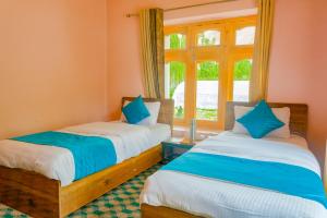 Ένα ή περισσότερα κρεβάτια σε δωμάτιο στο Wanla Eco Homestay