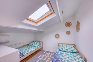 Un pat sau paturi într-o cameră la La Maison des Sables - Maison pour 6 parking privé +6 fotografii