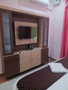 Postel nebo postele na pokoji v ubytování Shree Nanda Guest House
