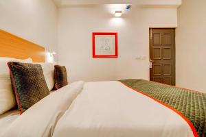 Postel nebo postele na pokoji v ubytování Hotel O Star Key