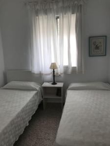Ένα ή περισσότερα κρεβάτια σε δωμάτιο στο Apartamento primera linea de playa