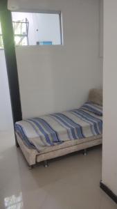 a bedroom with a bed in a room at Loft Geribá in Búzios