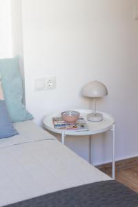 Postel nebo postele na pokoji v ubytování VLC HOST- B&B Fray Pedro