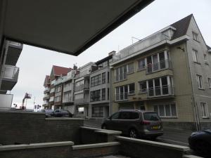 a van parked in front of a building at Silver Sunrise Studio in De Haan