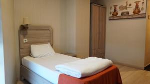 Postel nebo postele na pokoji v ubytování World Point Hotel Besyol
