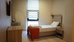 Postel nebo postele na pokoji v ubytování World Point Hotel Besyol