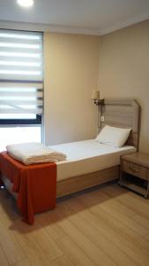 Postel nebo postele na pokoji v ubytování World Point Hotel Besyol